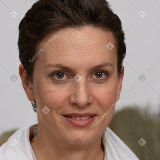 Joyful white adult female with short  brown hair and brown eyes