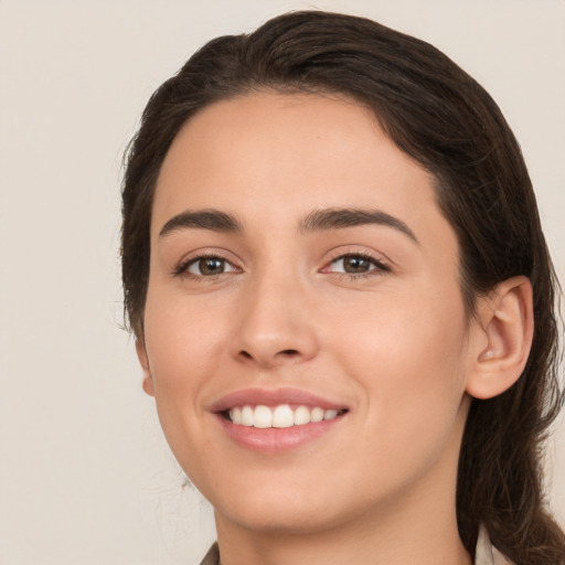 Joyful white young-adult female with medium  brown hair and brown eyes