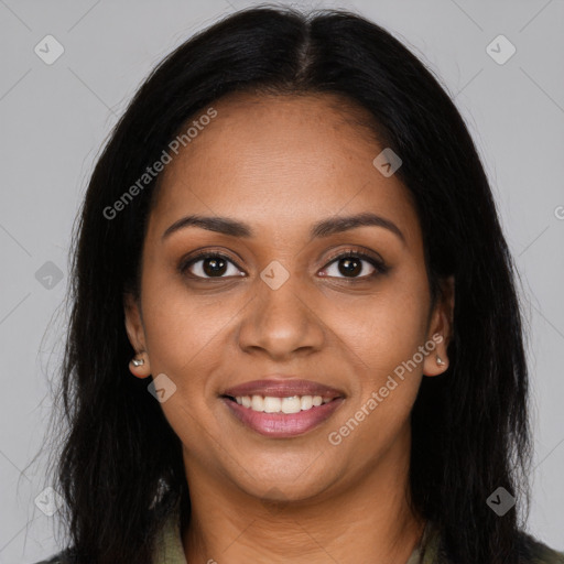 Joyful black young-adult female with long  brown hair and brown eyes