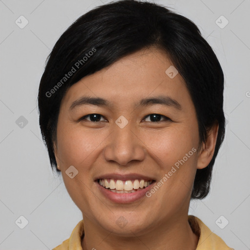 Joyful asian young-adult female with medium  black hair and brown eyes