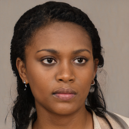 Neutral black young-adult female with long  black hair and brown eyes