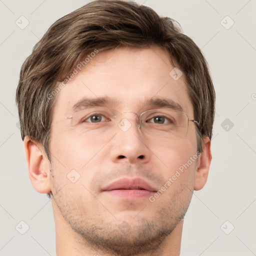 Neutral white adult male with short  brown hair and grey eyes