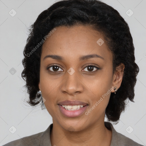 Joyful black young-adult female with long  black hair and brown eyes