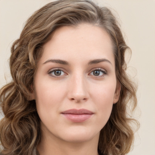 Joyful white young-adult female with long  brown hair and green eyes