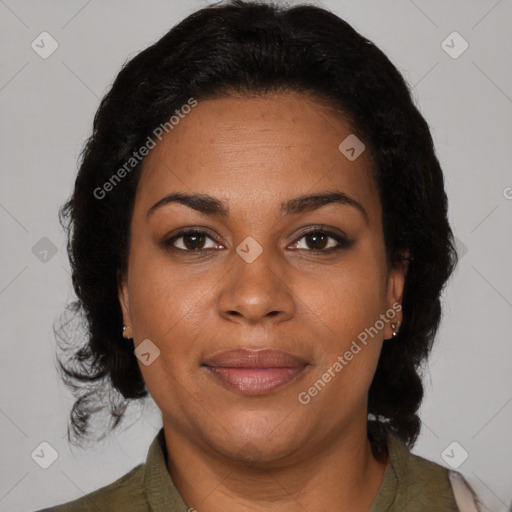 Joyful black adult female with medium  brown hair and brown eyes