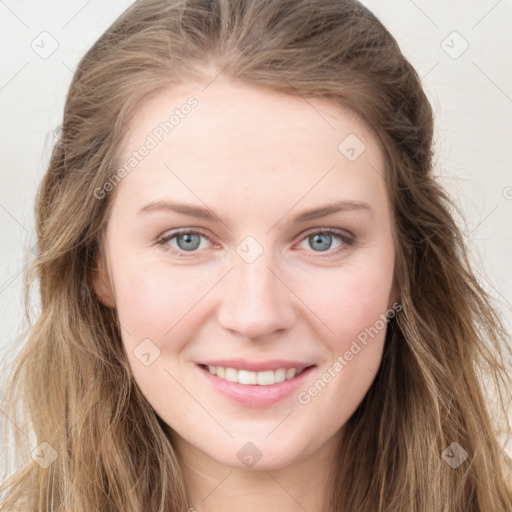 Joyful white young-adult female with long  brown hair and blue eyes