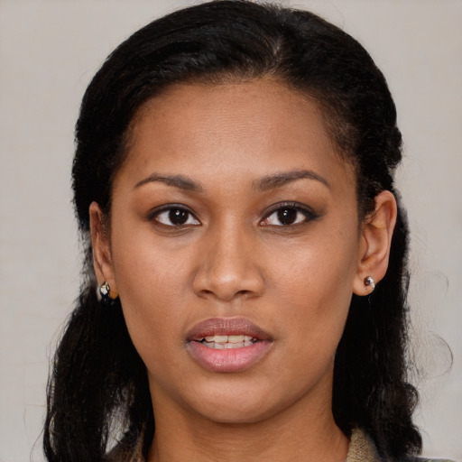 Joyful black young-adult female with medium  brown hair and brown eyes