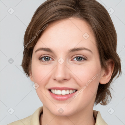 Joyful white young-adult female with medium  brown hair and grey eyes