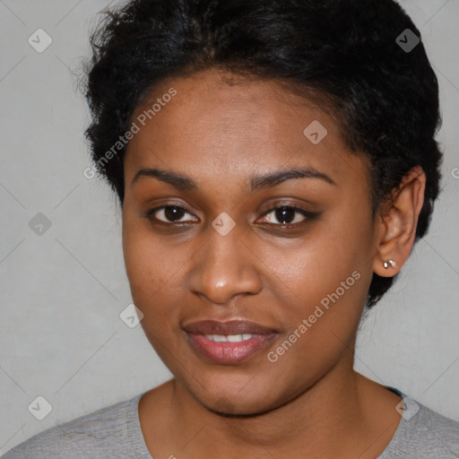 Joyful black young-adult female with short  black hair and brown eyes