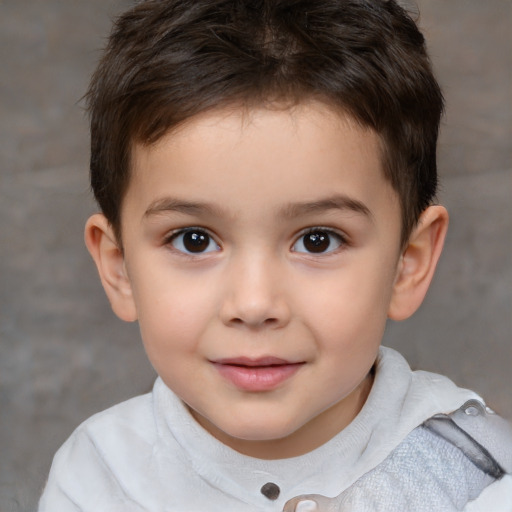 Joyful white child male with short  brown hair and brown eyes