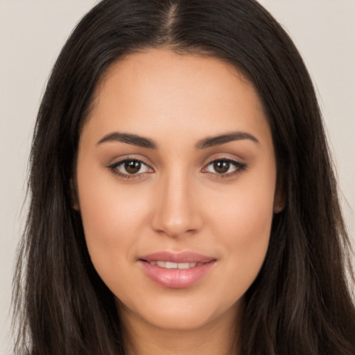 Joyful latino young-adult female with long  brown hair and brown eyes