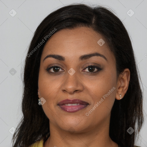 Joyful latino young-adult female with long  brown hair and brown eyes