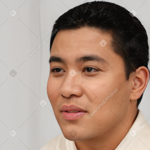 Joyful latino young-adult male with short  black hair and brown eyes