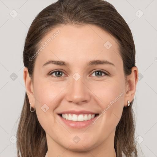 Joyful white young-adult female with medium  brown hair and grey eyes