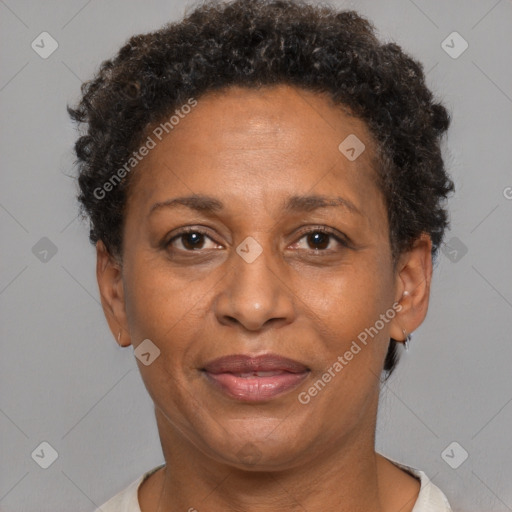 Joyful black adult female with short  brown hair and brown eyes