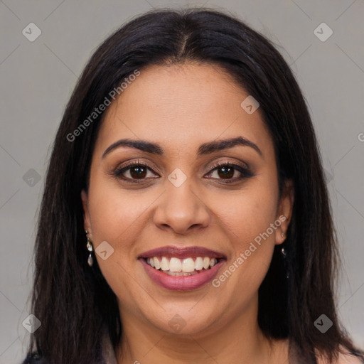 Joyful latino young-adult female with long  brown hair and brown eyes