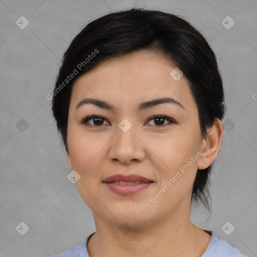 Joyful asian young-adult female with medium  black hair and brown eyes