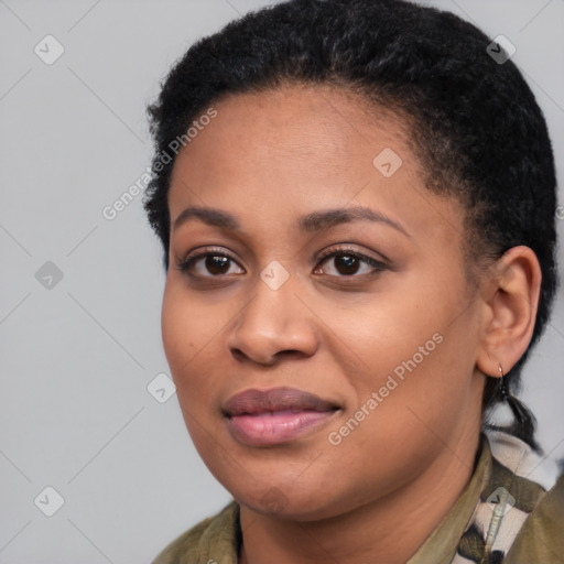 Joyful black young-adult female with short  brown hair and brown eyes