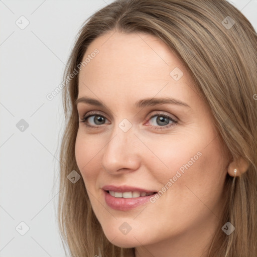 Joyful white young-adult female with long  brown hair and grey eyes