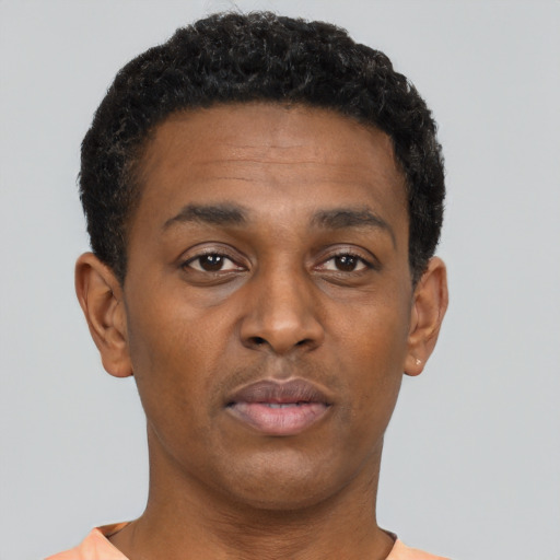 Neutral black young-adult male with short  black hair and brown eyes