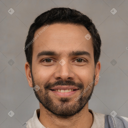 Joyful white young-adult male with short  black hair and brown eyes