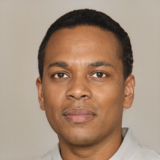 Neutral black young-adult male with short  black hair and brown eyes