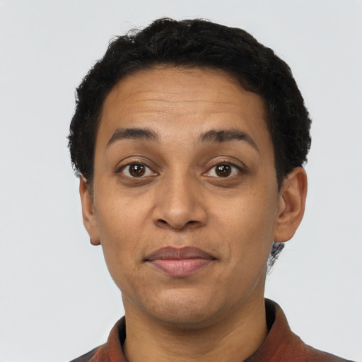 Joyful latino adult female with short  brown hair and brown eyes