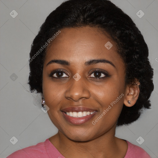 Joyful black young-adult female with medium  black hair and brown eyes