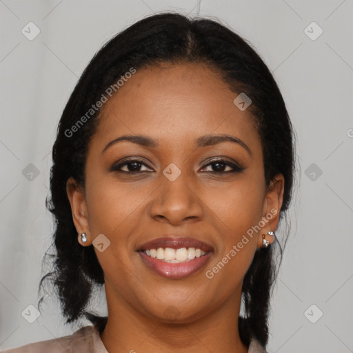 Joyful black young-adult female with long  brown hair and brown eyes