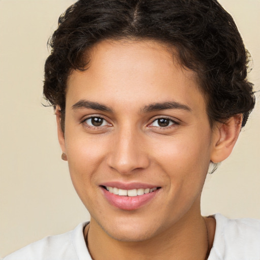 Joyful white young-adult female with short  brown hair and brown eyes