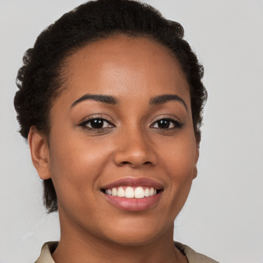 Joyful latino young-adult female with short  brown hair and brown eyes