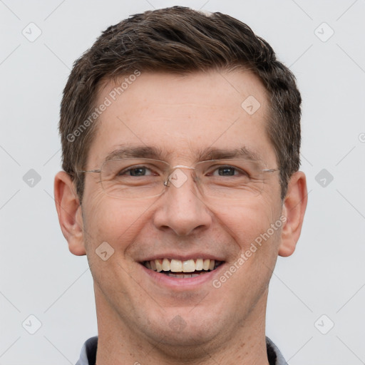 Joyful white adult male with short  brown hair and grey eyes