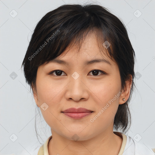 Joyful asian young-adult female with medium  brown hair and brown eyes