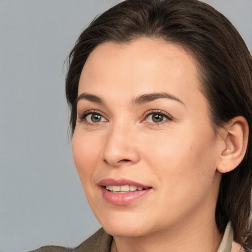 Joyful white young-adult female with medium  brown hair and brown eyes