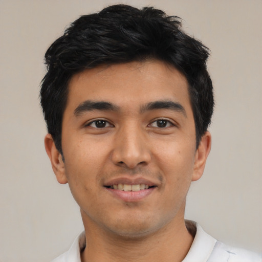 Joyful asian young-adult male with short  black hair and brown eyes
