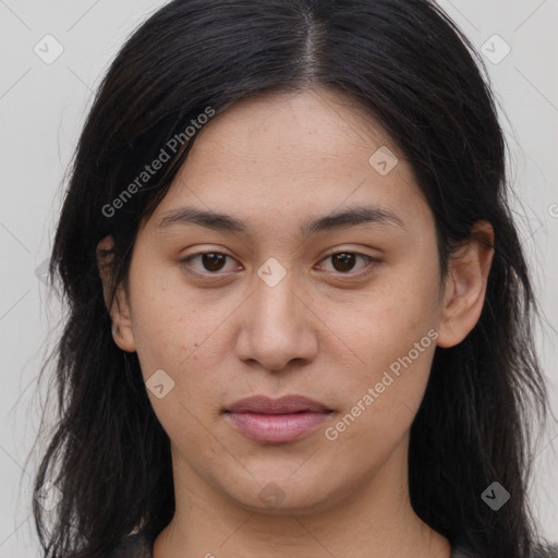 Joyful asian young-adult female with long  brown hair and brown eyes