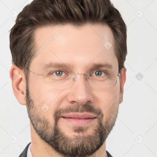 Joyful white adult male with short  brown hair and grey eyes