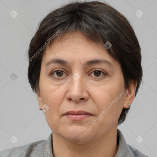 Joyful white adult female with short  brown hair and brown eyes