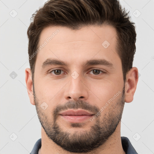 Joyful white young-adult male with short  brown hair and brown eyes