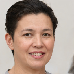 Joyful white adult female with short  brown hair and brown eyes