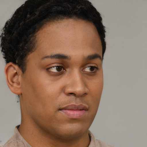 Neutral latino young-adult male with short  brown hair and brown eyes