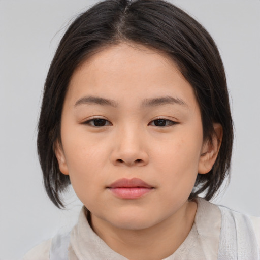 Neutral asian child female with medium  brown hair and brown eyes