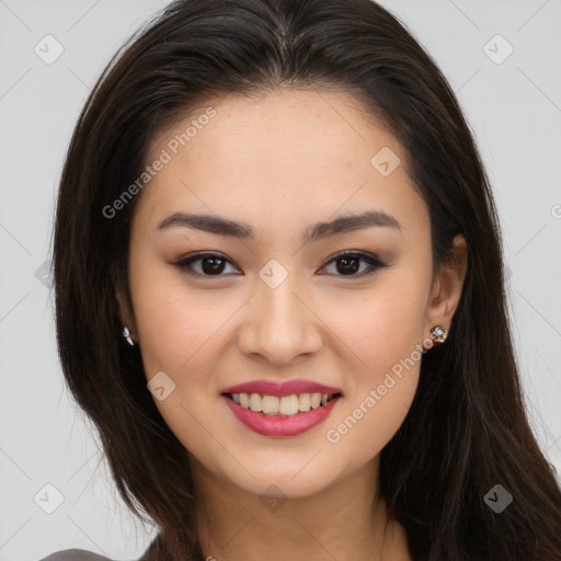 Joyful asian young-adult female with long  brown hair and brown eyes