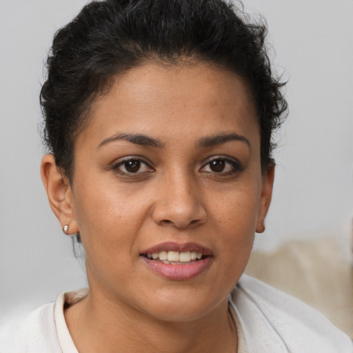 Joyful white young-adult female with short  brown hair and brown eyes