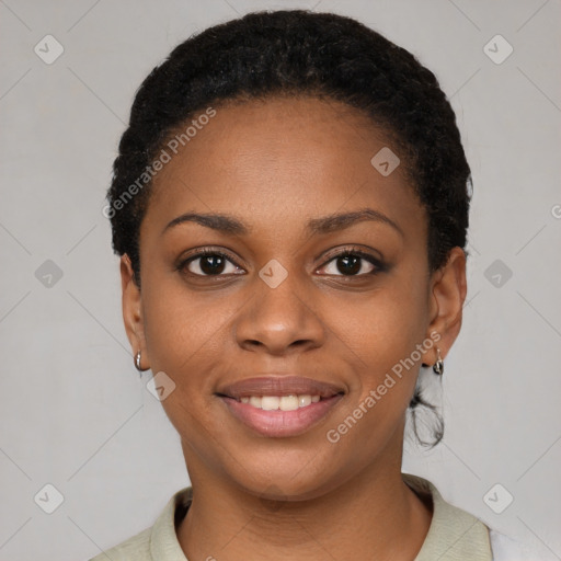 Joyful black young-adult female with short  black hair and brown eyes