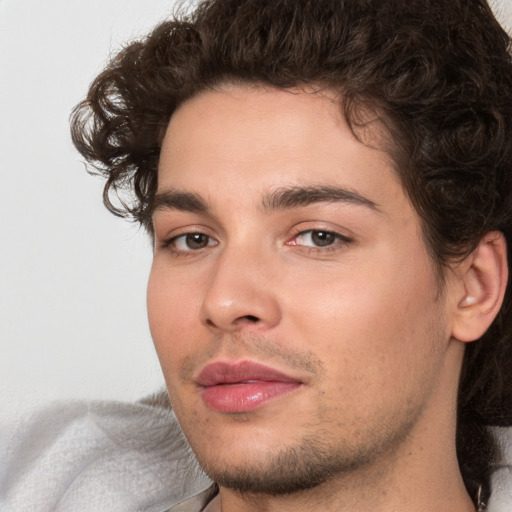 Joyful white young-adult male with medium  brown hair and brown eyes