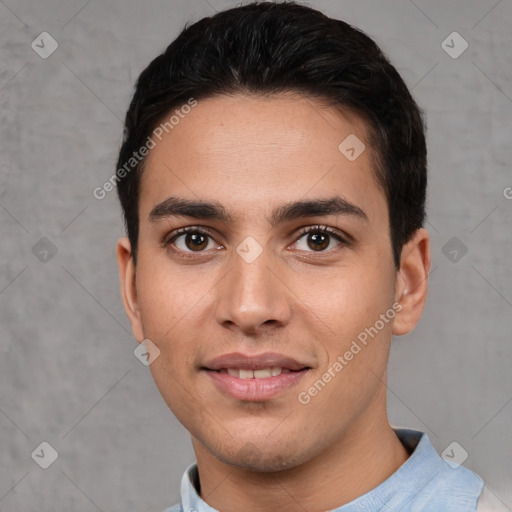 Joyful white young-adult male with short  black hair and brown eyes