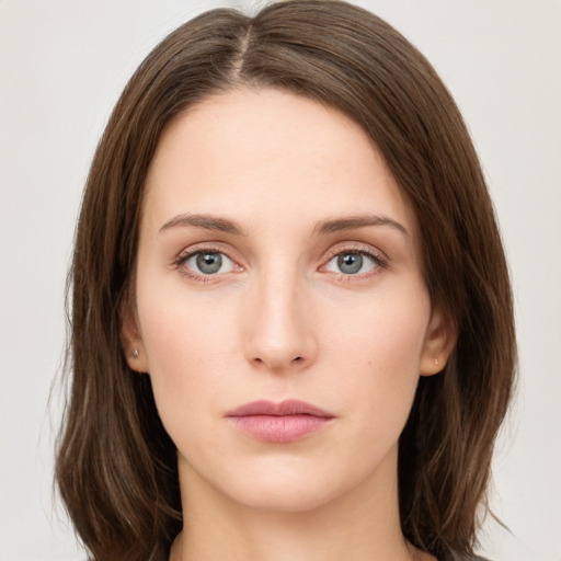 Neutral white young-adult female with medium  brown hair and green eyes