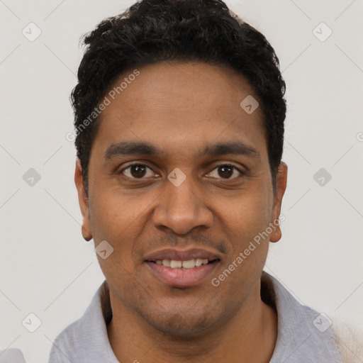 Joyful black young-adult male with short  black hair and brown eyes