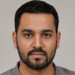 Neutral latino young-adult male with short  black hair and brown eyes